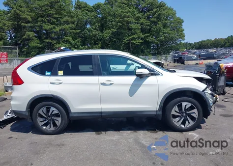 2015 Honda Cr-V Touring z USA, uszkodzony, nr VIN 5J6RM4H92FL116338